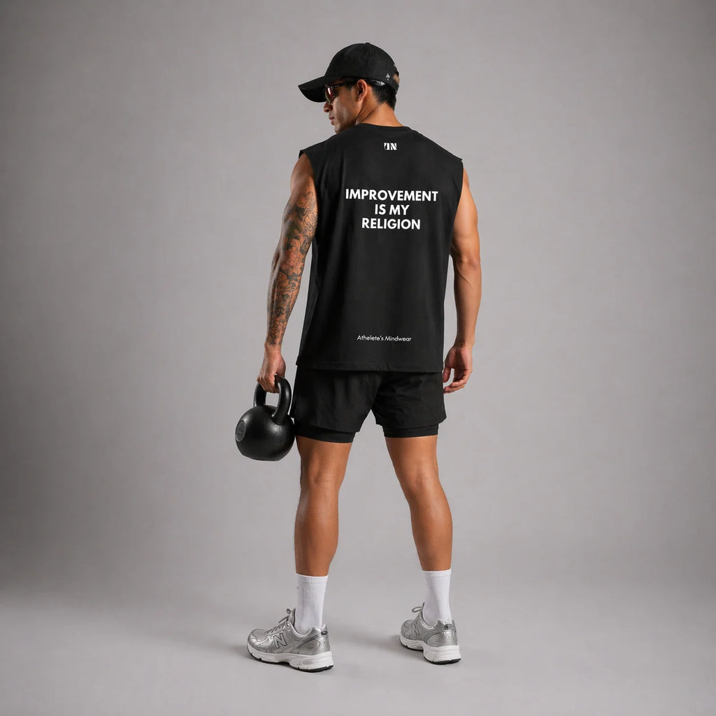 UNPROVEN black sleeveless tank top men with "Improvement is my religion" back graphic oversized gym fit, workout tank from the wide view