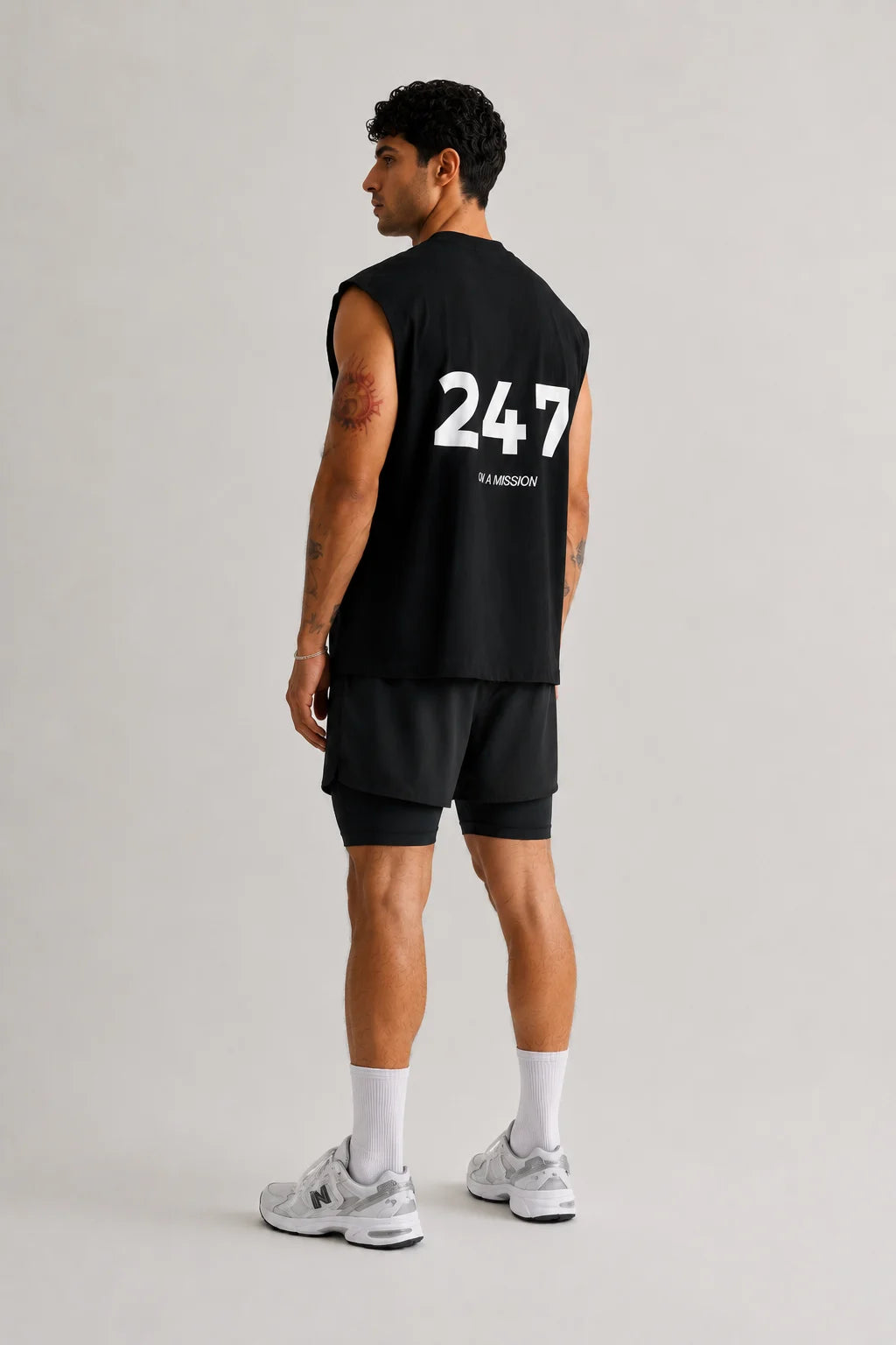 Athlete wearing Team 247 unisex tank during workout and active training